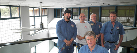 The crew from the physical plant pose in front of the new ECE 